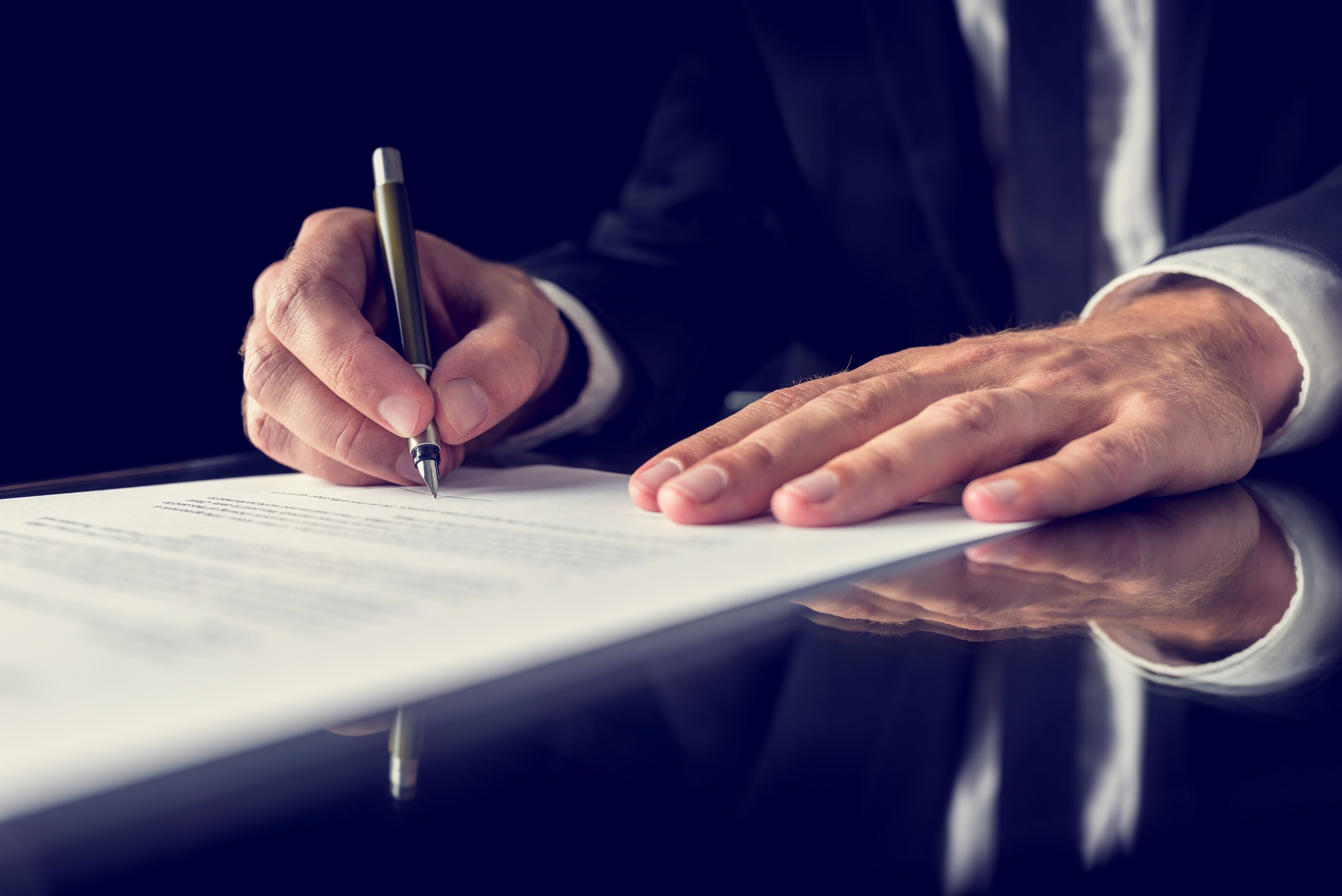 Plaintiff Signing legal settlement document